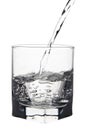 Water with air bubbles pouring into glass, closeup view, isolate Royalty Free Stock Photo