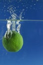 Water in the air from lime dropped in water. Royalty Free Stock Photo