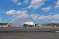 Water arch on the apron of the airport - salute from water cannons in honor of the first arrival of the Boeing 787