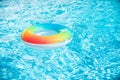 Water background. Pool float, ring floating in a refreshing blue swimming pool. Summer background. Royalty Free Stock Photo