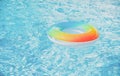 Water background. Pool float, ring floating in a refreshing blue swimming pool. Summer background. Royalty Free Stock Photo