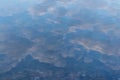 Water background where the sky is reflected with the sun and fluffy clouds Royalty Free Stock Photo