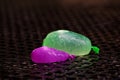 Water balloons remnants outside on wet table