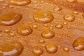 Water beads on treated cedar deck Royalty Free Stock Photo