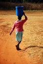 The water bearer - Pomerini - Tanzania - Africa Royalty Free Stock Photo