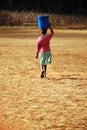 The water bearer - Pomerini - Tanzania - Africa Royalty Free Stock Photo