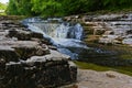 Water becomes blurred as it flows over Stainforth force Royalty Free Stock Photo