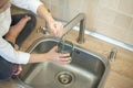 Water being poured into glass from kitchen tap. Zero waste and no plastic conscious minimalism lifestyle concept. ÃÂ¡aring for the Royalty Free Stock Photo