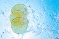 Water being poured in some lemon slices