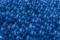 Water blue gel balls with bokeh. Polymer gel. Silica gel. Balls of blue hydrogel. Crystal liquid ball with reflection. Blue textur