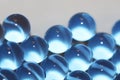 Water blue gel balls. Polymer gel. Silica gel. Balls of blue hydrogel. Crystal liquid ball with reflection. Texture background. Royalty Free Stock Photo