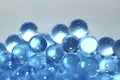 Water blue gel balls. Polymer gel. Silica gel. Balls of blue hydrogel. Crystal liquid ball with reflection. Texture background. Royalty Free Stock Photo