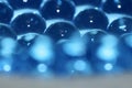 Water blue gel balls. Polymer gel. Silica gel. Balls of blue hydrogel. Crystal liquid ball with reflection. Texture background. Royalty Free Stock Photo