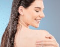 Water, body shower and happy woman on studio blue background for healthy skincare, beauty and personal hygiene. Young Royalty Free Stock Photo