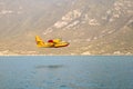 Water bomber firefighting plane over Garda Lake Royalty Free Stock Photo