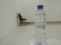 water on the bottle and black chair