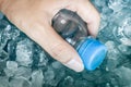 Water bottle in blue ice cube Royalty Free Stock Photo