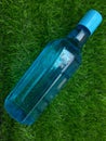 Water bottle on green grass as background Royalty Free Stock Photo