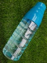 Water bottle on green grass as background Royalty Free Stock Photo