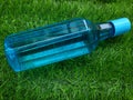 Water bottle on green grass as background Royalty Free Stock Photo