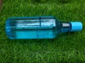 Water bottle on green grass as background Royalty Free Stock Photo