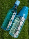 Water bottle on green grass as background Royalty Free Stock Photo