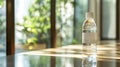 Water bottle with a plain label standing on a reflective wooden surface Royalty Free Stock Photo