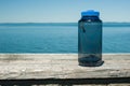 Water bottle sitting on a shelf