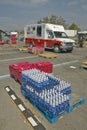 Water bottles in front of Red Cross truck Royalty Free Stock Photo