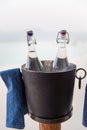 Water bottles in ice bucket at hotel beach Royalty Free Stock Photo