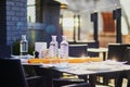 Water bottles and traditional French bread baguette on the table of outdoor cafe or restaurant in Etretat with view to the Royalty Free Stock Photo