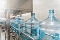 Water bottling conveyor line with plastic bottles or gallons on water factory production Royalty Free Stock Photo