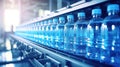 Water bottling plant processes and bottles pure spring water into blue bottles Royalty Free Stock Photo