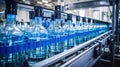 Water bottling plant processes and bottles pure spring water into blue bottles Royalty Free Stock Photo