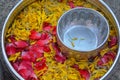 Water in bowl mixed with perfume and flowers Royalty Free Stock Photo