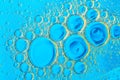 Water bubbles on blue and yellow background. Scientific image of cell membrane. Macro up of liquid substances. Abstract molecule a