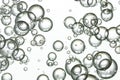 Water bubbles falling over white Royalty Free Stock Photo