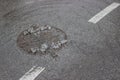 Water bubbling up through manhole cover and sewer Royalty Free Stock Photo