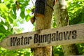 Water bungalows wooden sign at the tropical island Royalty Free Stock Photo