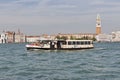 Water bus sails in Venice lagoon, Italy.