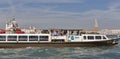 Water bus sails in Venice lagoon, Italy.