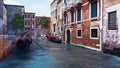 Water canal and ancient buildings in Venice, Italy