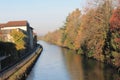 Water Canal channel and reflections of trees and buildings in Robbecoo sul Naviglio, Italy