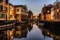 Water canal at dusk,Venice,Italy.Typical boat transportation,Venetian travel urban scene.Water transport.Popular tourist Royalty Free Stock Photo