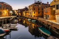 Water canal at dusk,Venice,Italy.Typical boat transportation,Venetian travel urban scene.Water transport.Popular tourist Royalty Free Stock Photo