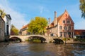 Water canal with old bridge and medieval houses at Begijnhof, Bruges, Belgium Royalty Free Stock Photo