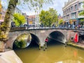 Water canals with arched brick bridge in Utrecht for tourist boat trips