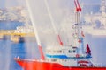Water cannon ship shrouded in fog Royalty Free Stock Photo