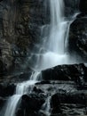 Water cascade on black stones Royalty Free Stock Photo