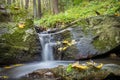 Water cascade on stream in autumn forest Royalty Free Stock Photo